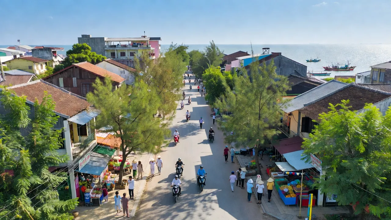 Khung cảnh thị trấn Gành Hào, Bạc Liêu, với biển Đông và cây xanh, thể hiện văn hóa địa phương.