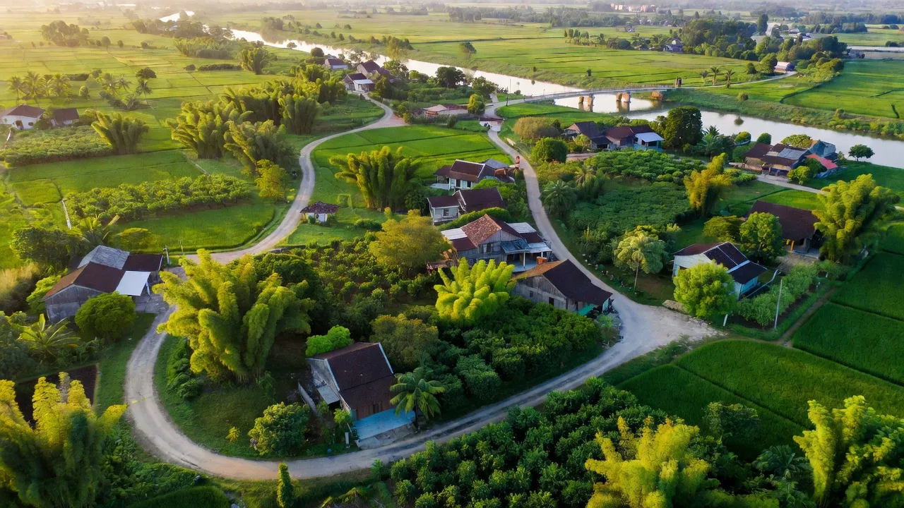 Cảnh quan Xã Kim Đính, Huyện Kim Thành, tỉnh Hải Dương với đường quê và nhà cửa xanh mát.