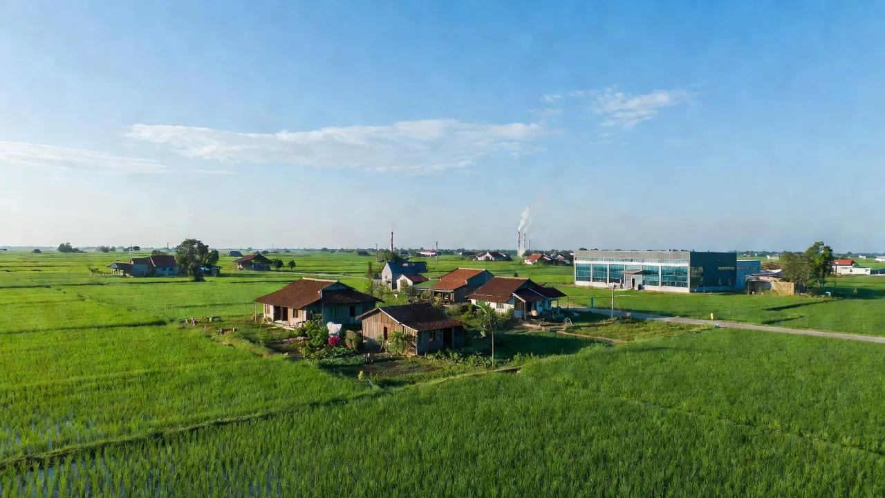 Hưng Đạo, Tứ Kỳ, Hải Dương with lush fields, traditional houses, and blue skies.