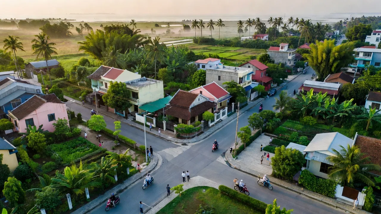 Quang Trung, Thủy Nguyên, Hải Phòng with residential areas, roads, lush greenery, coastal climate.