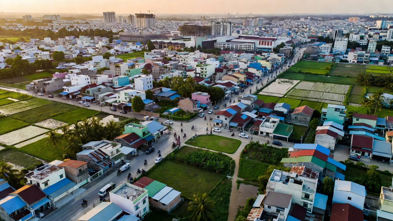 Quy Đức, huyện Bình Chánh, Thành phố Hồ Chí Minh, phong cảnh đô thị với cây xanh và nhà cửa.