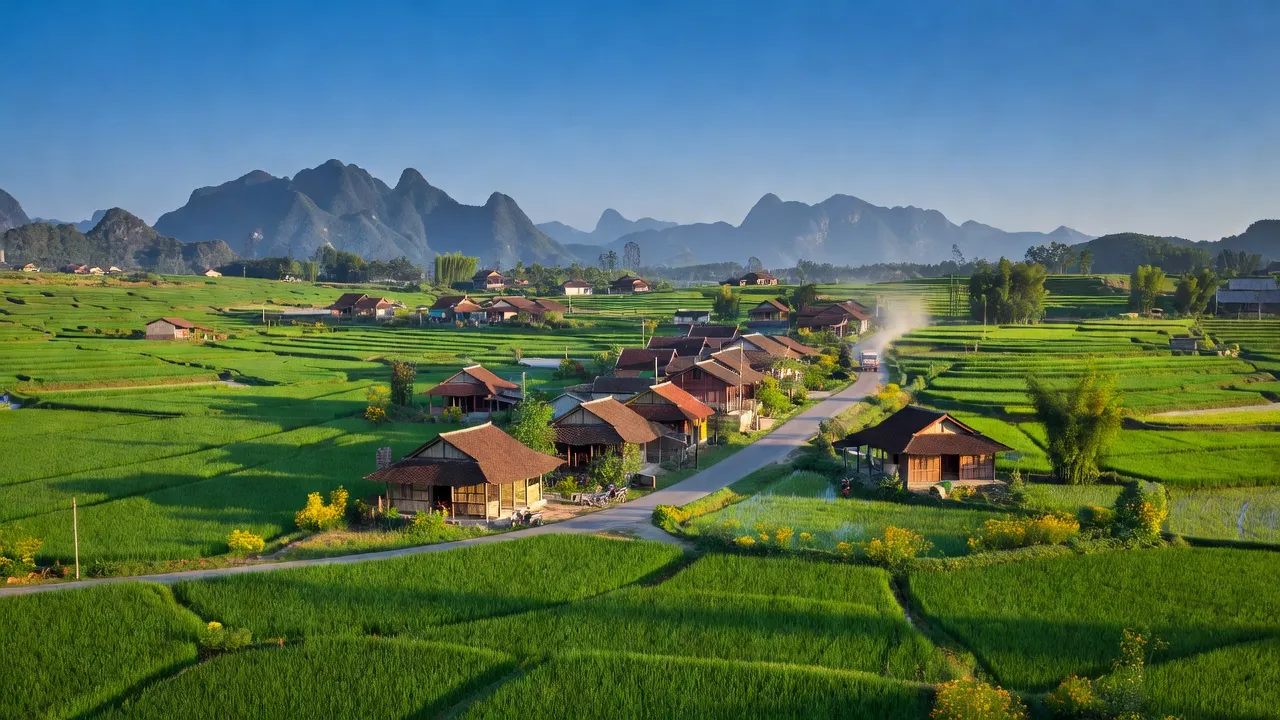 Vân Thủy village in Chi Lăng, Lạng Sơn, with rice fields and traditional houses under blue sky.