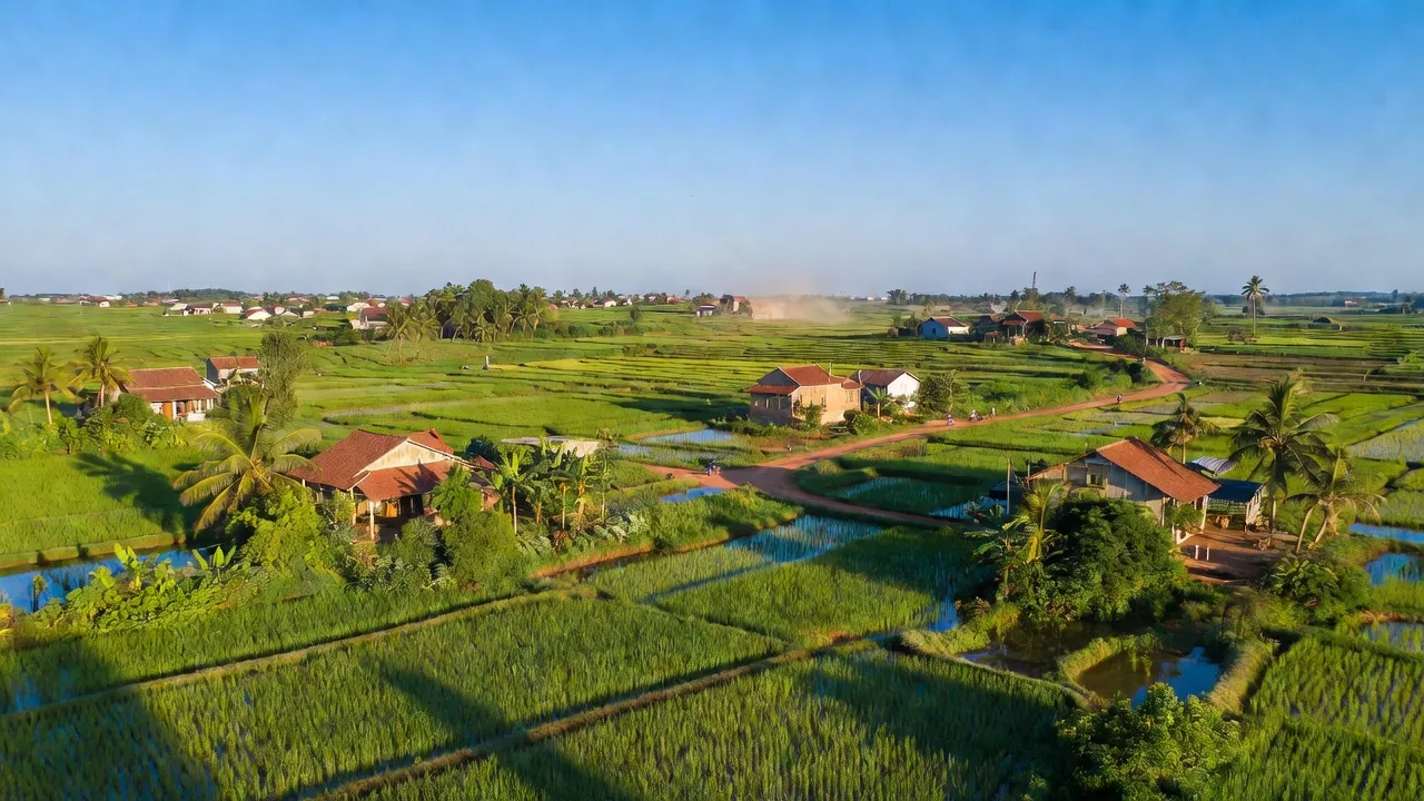 Cảnh quan Bình Hòa Hưng, Đức Huệ, Long An với cánh đồng, nhà cửa và bầu trời xanh.
