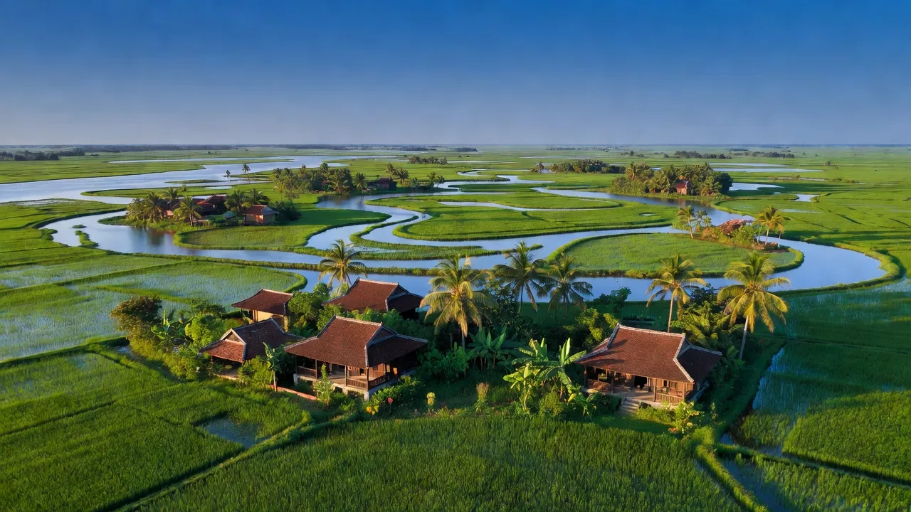 Cù Lao Dung landscape with green fields and rivers in Sóc Trăng, showcasing nature and local architecture.